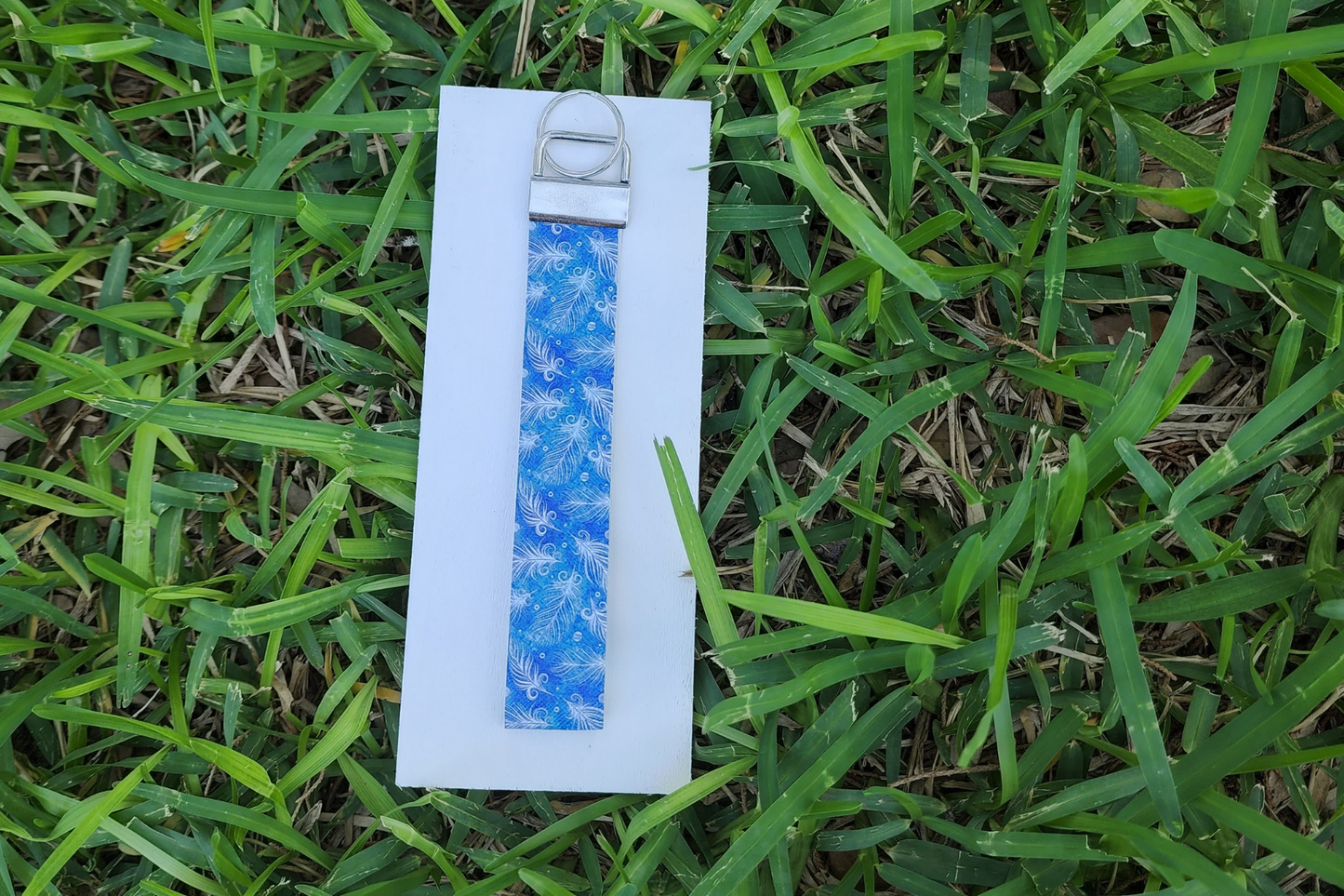 Blue feather wristlet