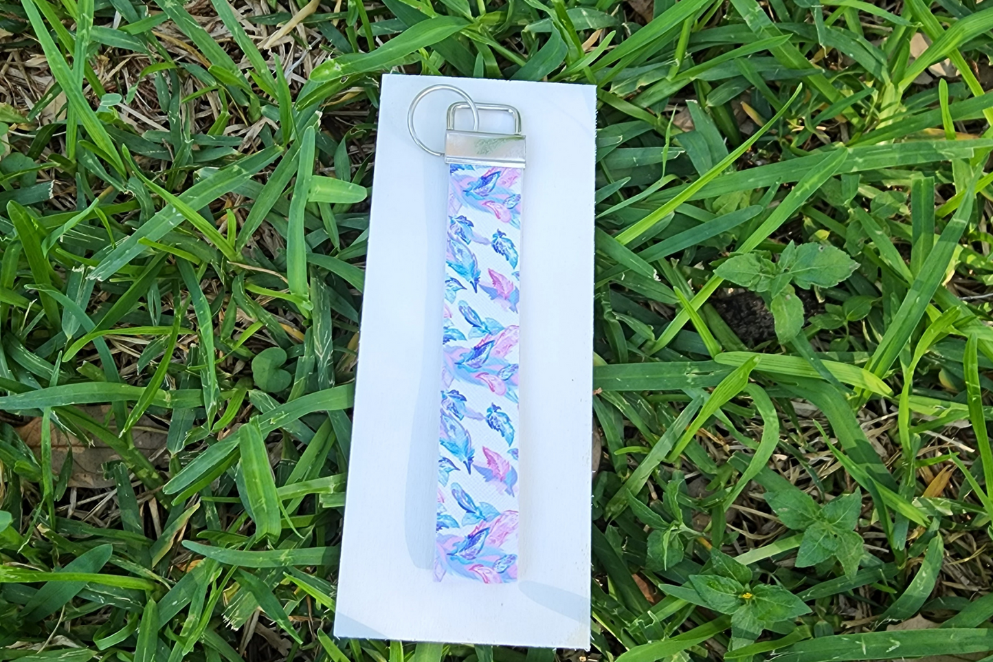 Blue and pink feather wristlet