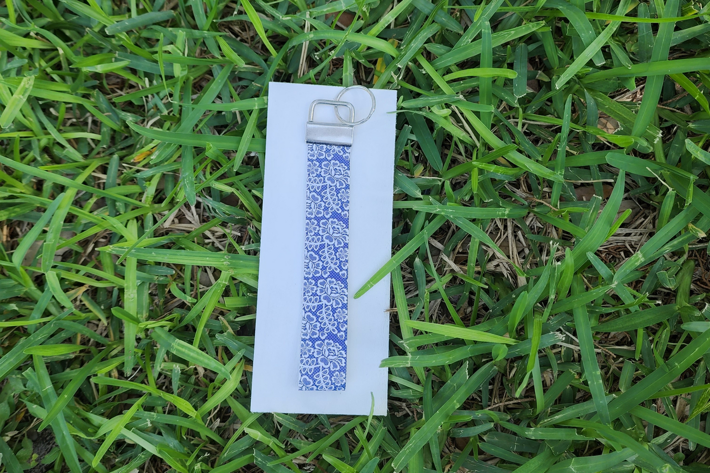 Blue lace/white flower wristlet